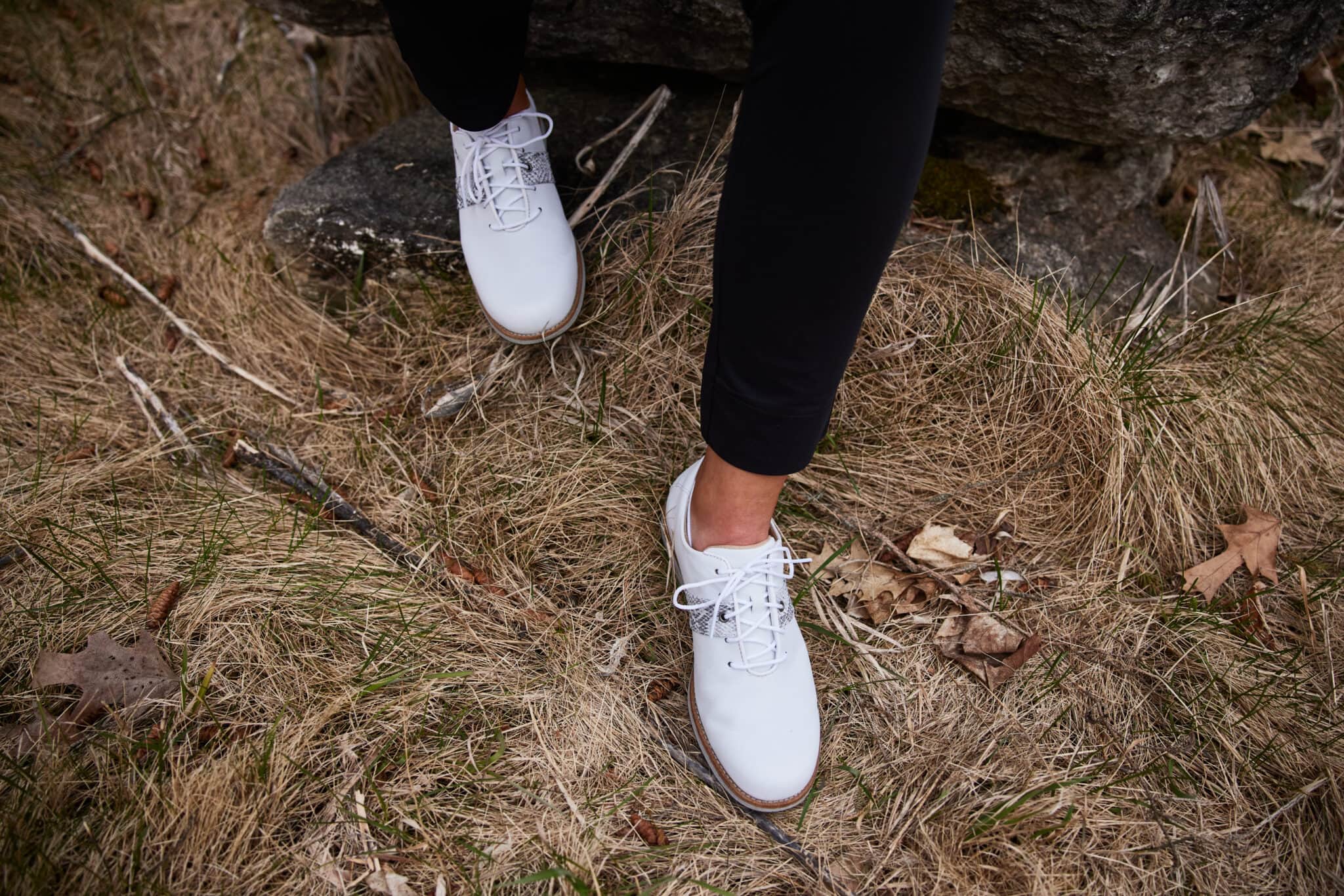 Close up of a woman's feet wearing a pair of stylish golf shoes in an example of LA based photographer's fitness advertising shoot.