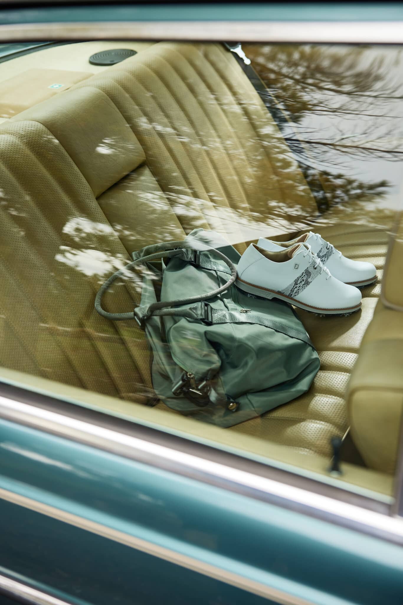 A pair of shoes viewed through a car window. Image taken by Los Angeles product photographer Hannah Dunsirn.