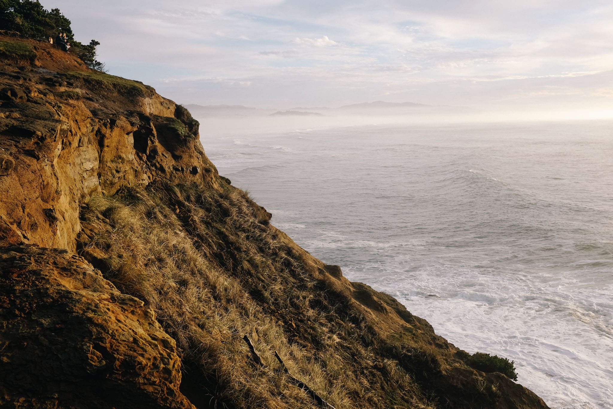 Rocky coast with hazy sunshine taken by LA lifestyle photographer